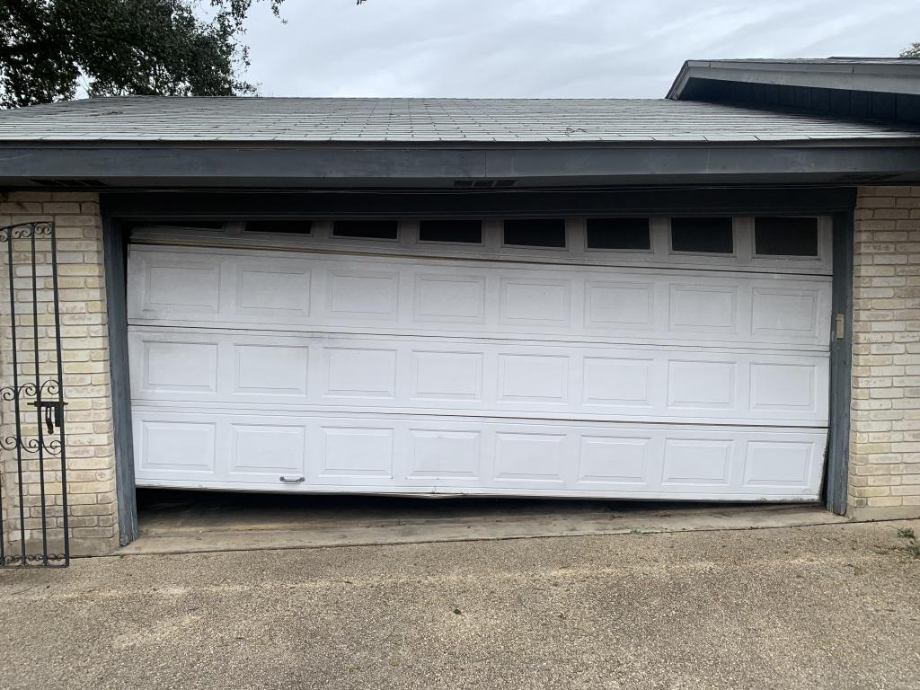 garage door off track garage door wheel off track how to fix garage door how to get garage door back on track putting garage door back on track garage door came off track