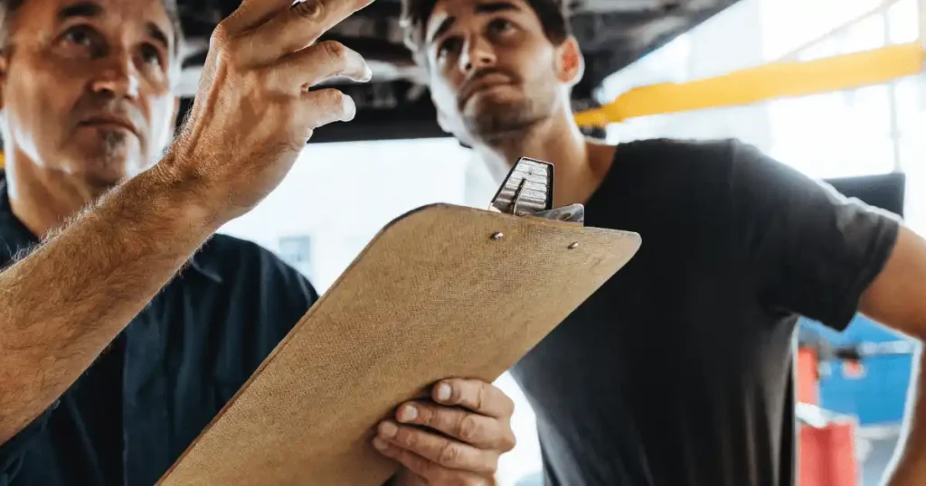 2 people talking with clipboard